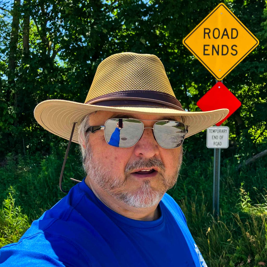 Photographer wearing a hat and sunglasses